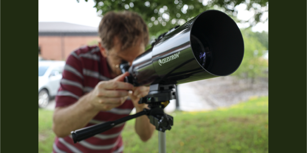 Paolo Viola, Technical Services Clerk, uses the new telescope kit from Lambton County Library